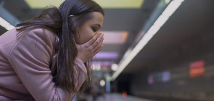 24-7MedCare Desperate lady suffering anxiety attack at subway station, feeling helpless